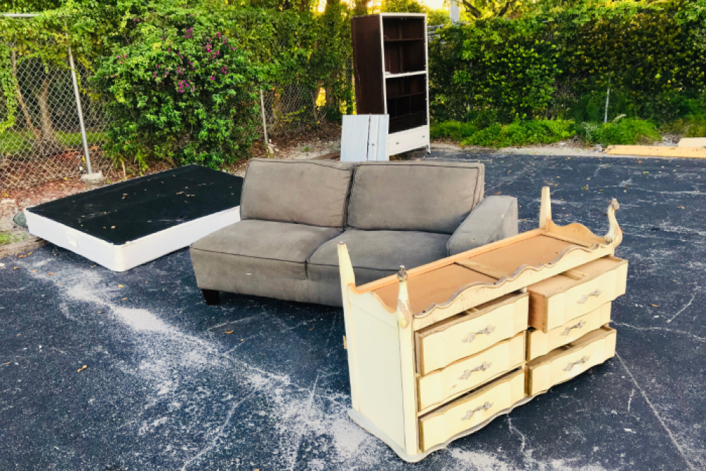 Furniture and belongings left abandoned on pavement