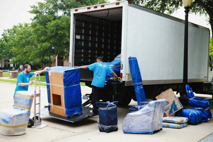 Delivery truck and movers from a professional moving company
